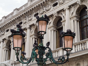 Low angle view of street light on building