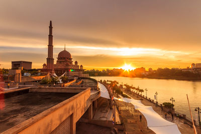 Panoramic view of buildings against sky during sunset