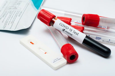 Doctor holding a test kit for viral disease covid 19. lab card kit test for viral novel coronavirus.