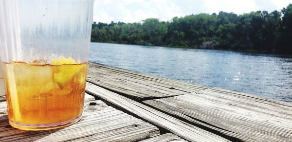 Close-up of drink on table water background