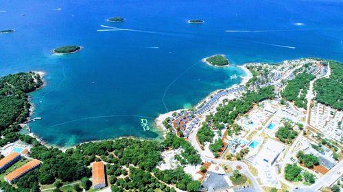 High angle view of sea and buildings in city