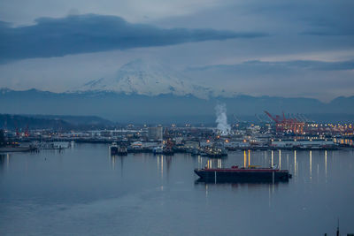 Port of tacoma and mount rainier at night.