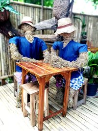 Rear view of chairs at table in market