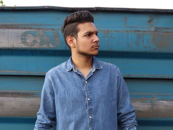 Portrait of young man looking away