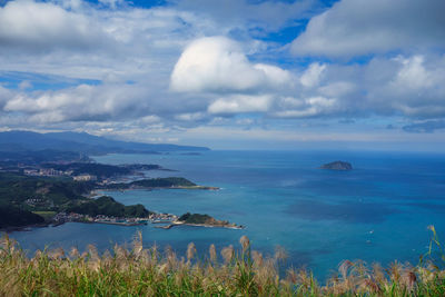 Panoramic view of the taiwanese shore from a mountain close to the famous city of jiufen