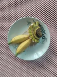 High angle view of fruits in plate on table