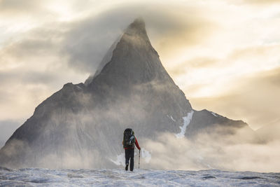 Mountaineer prepares for a day of climbing on baffin island.