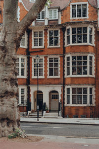 Facade of red brick apartment block in kensington, west london, uk. 