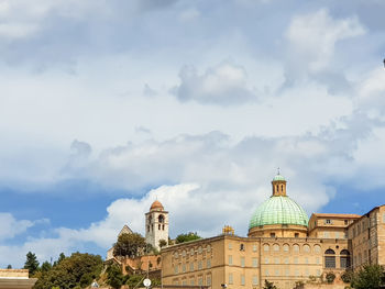 Historic building against cloudy sky