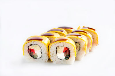 Close-up of sushi against white background