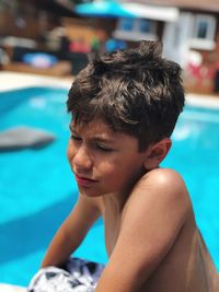 Close-up of young man  in swimming pool