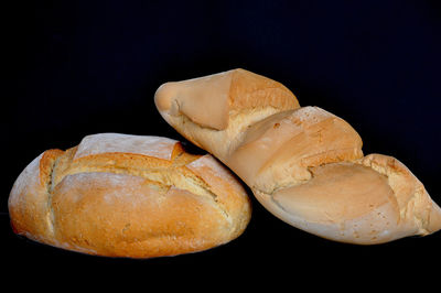 Close-up of bread on black background