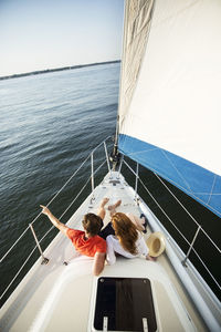High angle view of couple sitting in yacht