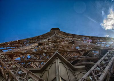 Low angle view of building against cloudy sky