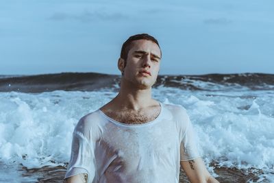 Portrait of young man in sea