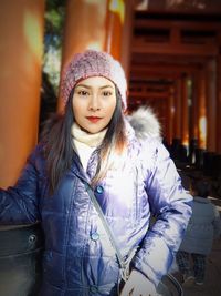 Portrait of beautiful woman in hat during winter