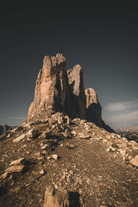 Low angle view of rock formation against sky