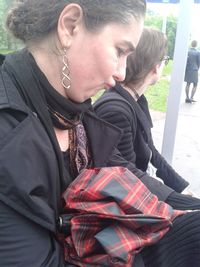 Young woman sitting outdoors