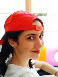 Close-up portrait of smiling young woman