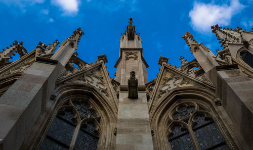 High section of cathedral against blue sky