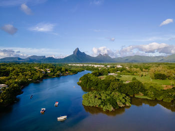 Scenic view of lake and mountains against sky