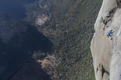 Rock climbing pulling through roof on top of the nose el capitan