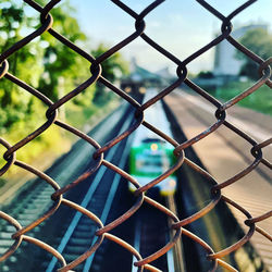 Full frame shot of chainlink fence against sky