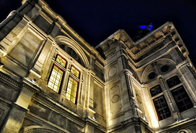 Low angle view of building against sky at night