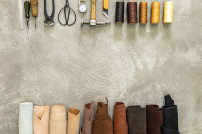 Directly above shot of leather and tanning equipment on floor