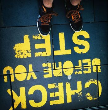Low section of man standing in front of text