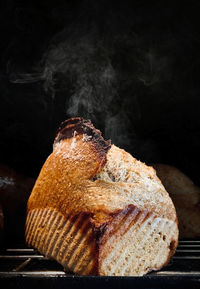 Close-up of food on table against black background