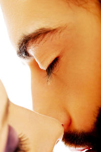 Close-up of young man against white background