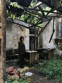 Full length of women against old building