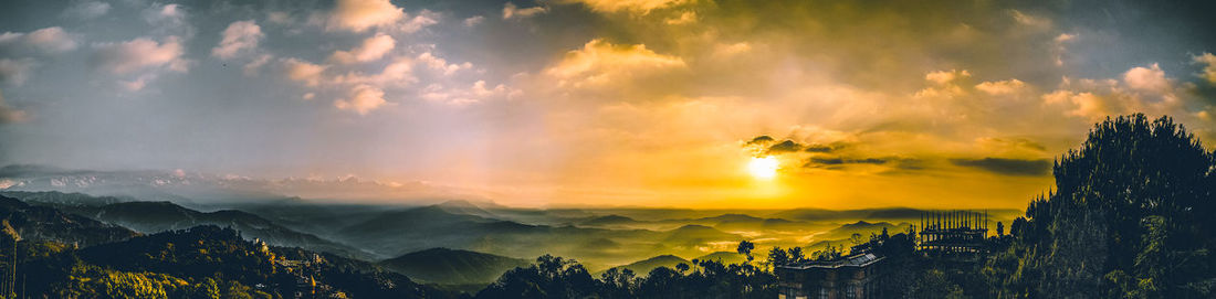 Panoramic view of mountains against sky during sunset