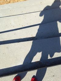 Shadow of people on road