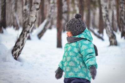 Rear view of man in snow
