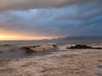 Scenic view of sea against dramatic sky