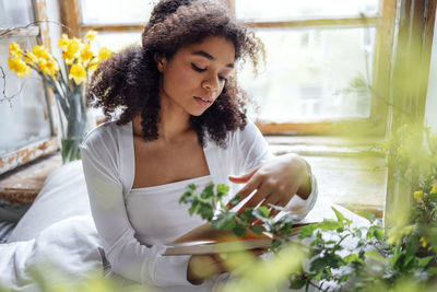 Young woman using mobile phone