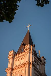 Low angle view of building against clear blue sky