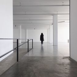 Woman walking in corridor