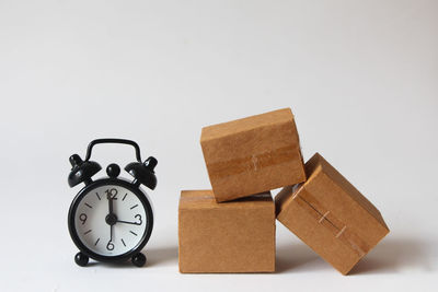 Close-up of alarm clock against white background