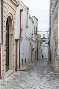 Footpath amidst buildings in town