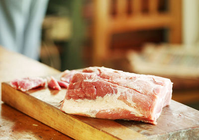 Close-up of raw meat on cutting board