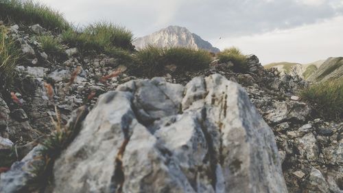 Rock formation on mountain against sky