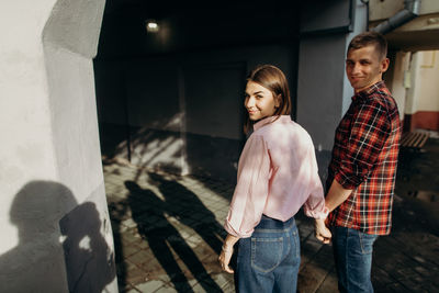 Portrait of smiling couple standing outdoors