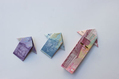 High angle view of paper currencies on white background