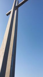 Low angle view of bridge against clear blue sky