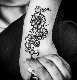 Close-up of person hand with tattoo