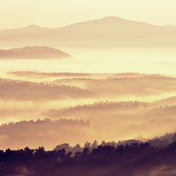 Scenic view of silhouette mountains against sky during sunset