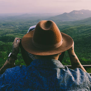 Rear view of woman with hat on mountain